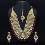 RANI - Maroon Pearl Kundan Necklace with Earrings & Maang Tikka